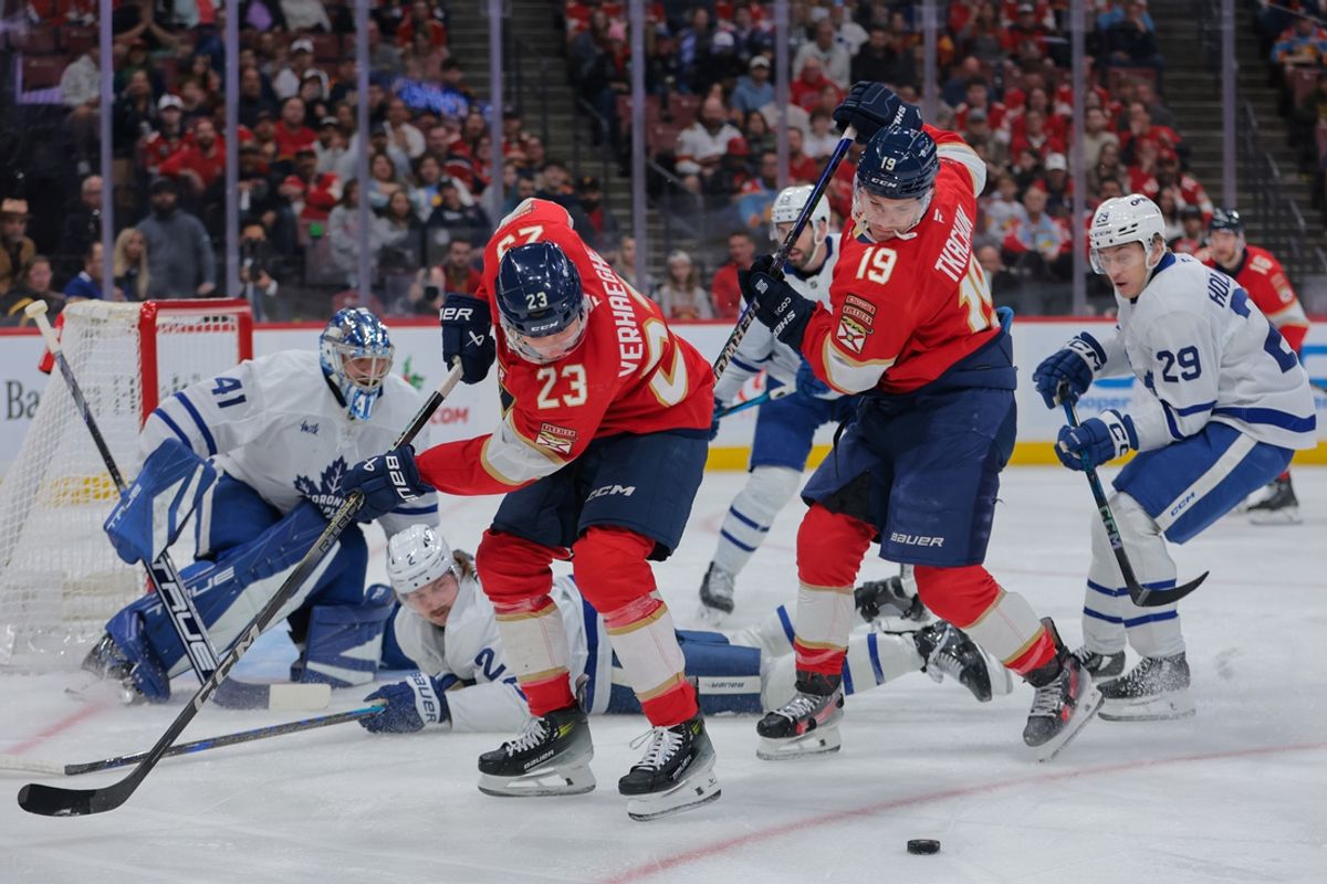 Nov 27, 2024; Sunrise, Florida, USA; Florida Panthers center Carter Verhaeghe (23) and left wing Matthew Tkachuk (19) control the puck against Toronto Maple Leafs during the first period at Amerant Bank Arena. Mandatory Credit: Sam Navarro-Imagn Images