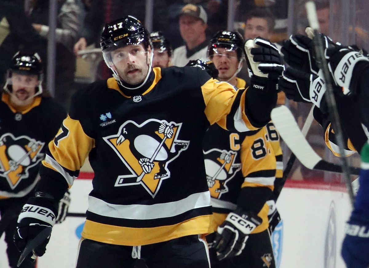 Nov 27, 2024; Pittsburgh, Pennsylvania, USA;  Pittsburgh Penguins right wing Bryan Rust (17) celebrates his second goal of the game with the Penguins bench against the Vancouver Canucks during the second period at PPG Paints Arena. Mandatory Credit: Charles LeClaire-Imagn Images