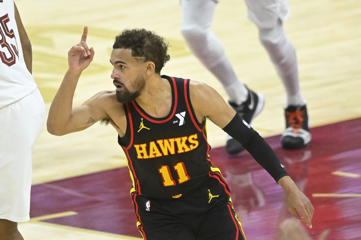 Atlanta Hawks guard Trae Young (11) celebrates his three-point basket in the fourth quarter against the Cleveland Cavaliers at Rocket Mortgage FieldHouse. Mandatory Credit: David Richard-Imagn Images