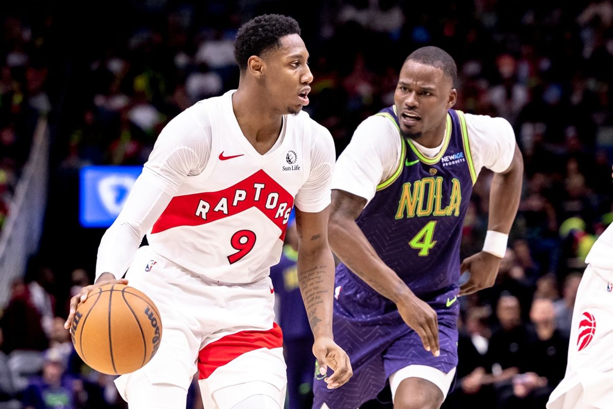 Nov 27, 2024; New Orleans, Louisiana, USA;  Toronto Raptors guard RJ Barrett (9) dribbles against New Orleans Pelicans guard Javonte Green (4) during the first half at Smoothie King Center. Mandatory Credit: Stephen Lew-Imagn Images