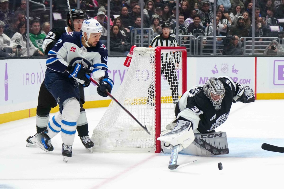 Nov 27, 2024; Los Angeles, California, USA; LA Kings goaltender David Rittich (31) defends the goal against Winnipeg Jets right wing Nino Niederreiter (62) in the first period at Crypto.com Arena. Mandatory Credit: Kirby Lee-Imagn Images