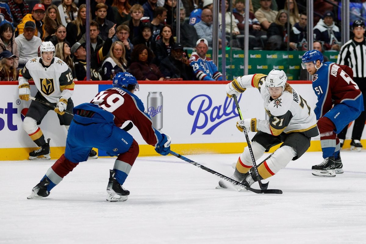 Nov 27, 2024; Denver, Colorado, USA; Vegas Golden Knights center William Karlsson (71) controls the puck under pressure from Colorado Avalanche defenseman Samuel Girard (49) in the first period at Ball Arena. Mandatory Credit: Isaiah J. Downing-Imagn Images