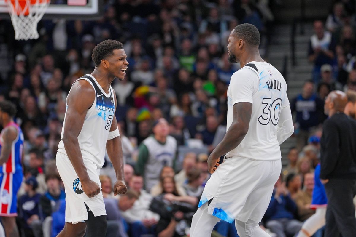 Nov 27, 2024; Minneapolis, Minnesota, USA; Minnesota Timberwolves guard Anthony Edwards (5) and forward Julius Randle (30) celebrate against the Sacramento Kings in the fourth quarter at Target Center. Mandatory Credit: Brad Rempel-Imagn Images