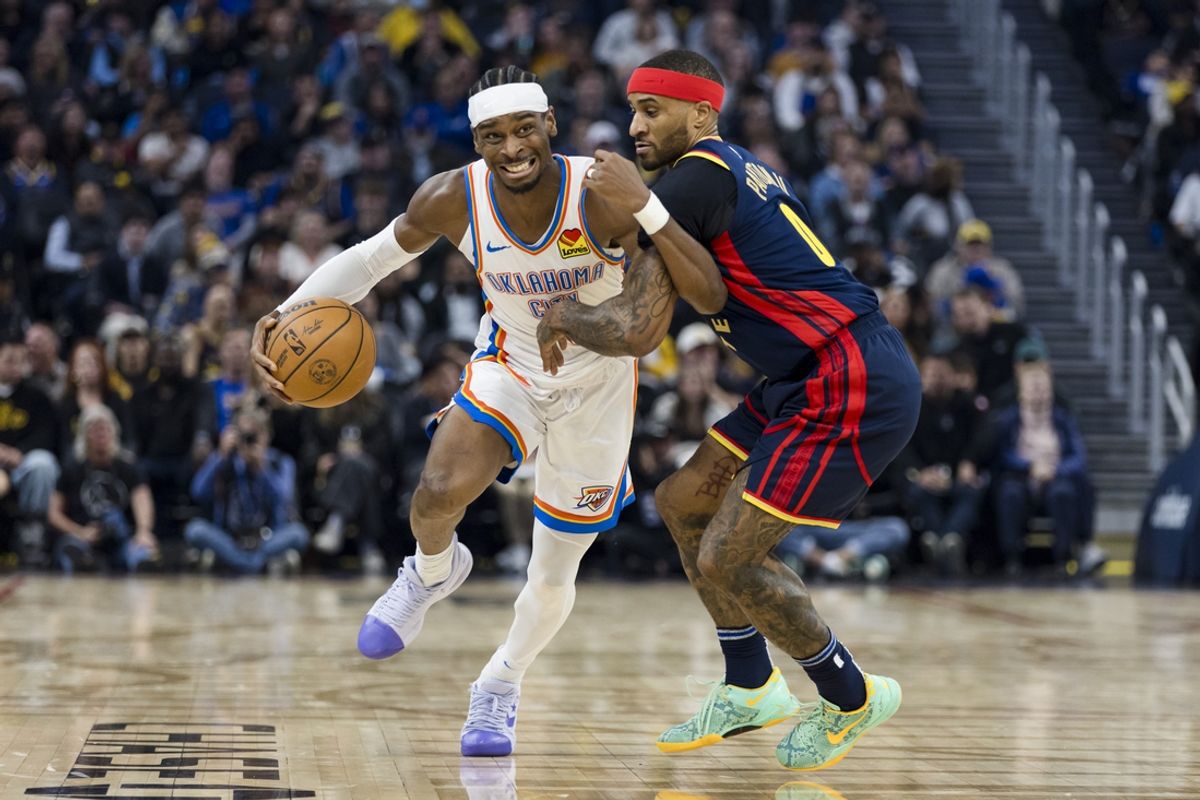 Nov 27, 2024; San Francisco, California, USA; Oklahoma City Thunder guard Shai Gilgeous-Alexander (2) rives past Golden State Warriors guard Gary Payton II (0) during the first half at Chase Center. Mandatory Credit: John Hefti-Imagn Images