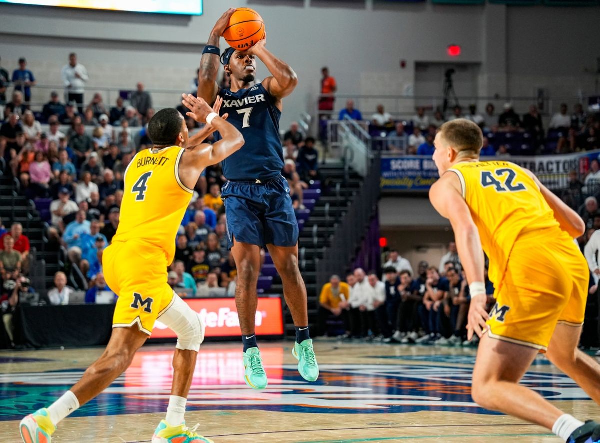 Xavier Musketeers guard Ryan Conwell (7) shoots the ball during the first half of the Fort Myers Tip-Off Beach Division final against the Michigan Wolverines at Suncoast Credit Union Arena in Fort Myers, Fla., on Wednesday, Nov. 27, 2024.