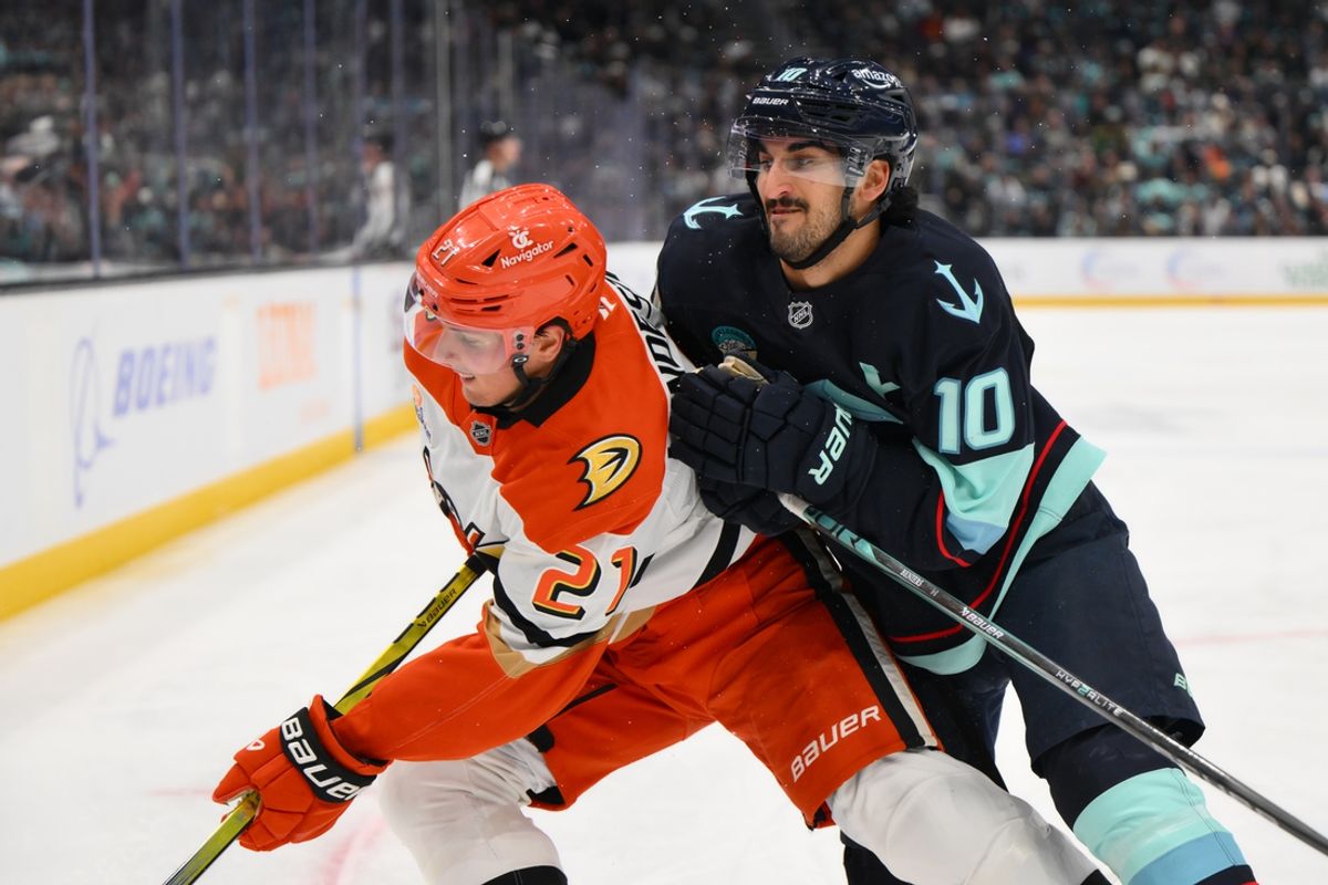 Nov 27, 2024; Seattle, Washington, USA; Seattle Kraken center Matty Beniers (10) collides with Anaheim Ducks center Isac Lundestrom (21) during the second period at Climate Pledge Arena. Mandatory Credit: Steven Bisig-Imagn Images