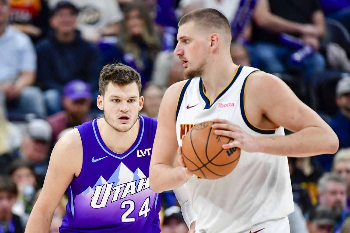 Nov 27, 2024; Salt Lake City, Utah, USA; Utah Jazz center Walker Kessler (24) defends Denver Nuggets center Nikola Jokic (15) during the second half at the Delta Center. Mandatory Credit: Christopher Creveling-Imagn Images