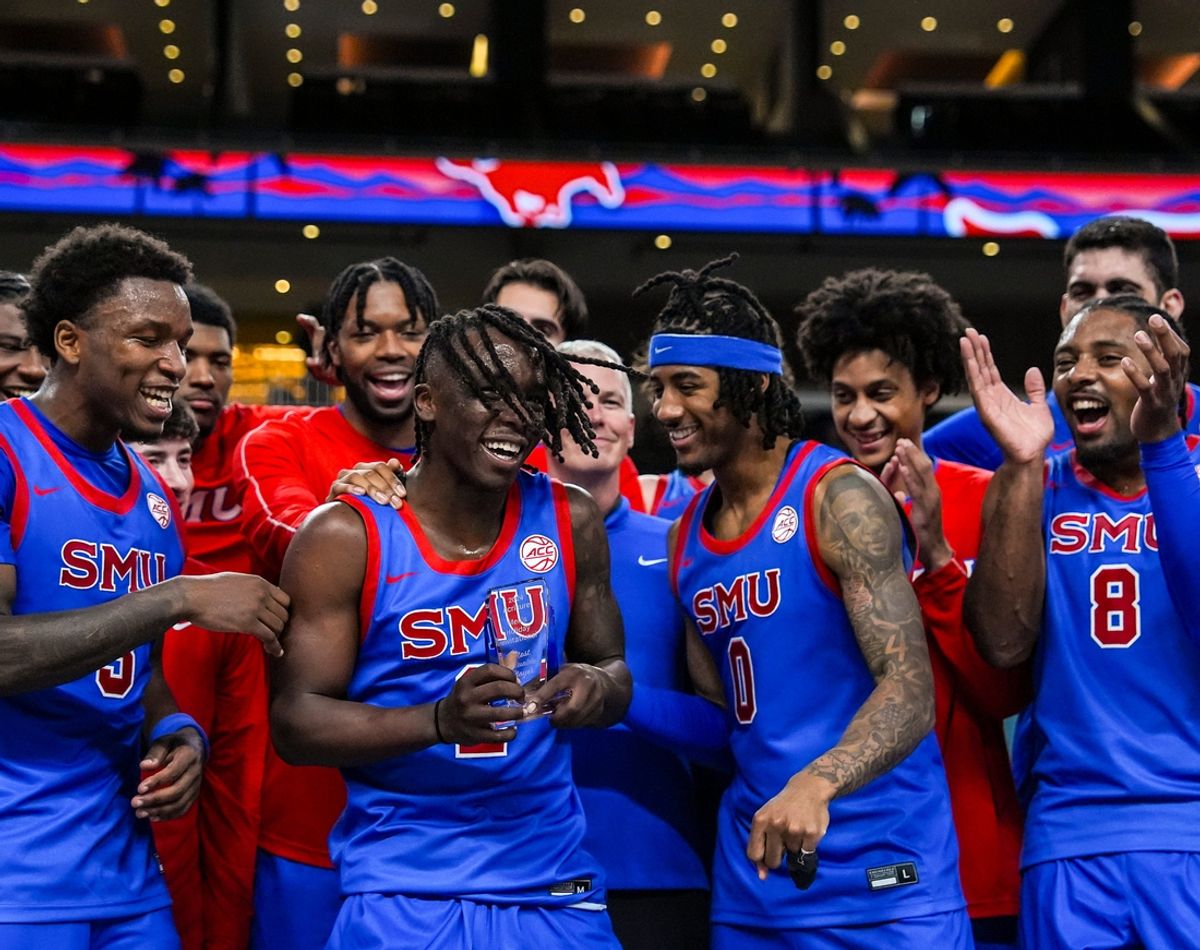 Southern Methodist Mustangs guard Boopie Miller is awarded the most valuable player trophy after winning their game in the Acrisure Series in Palm Desert, Calif., Wednesday, Nov. 27, 2024.