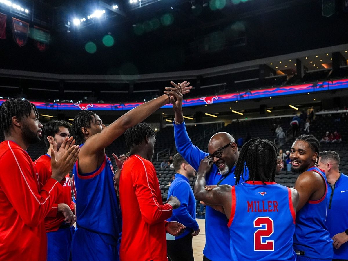 Southern Methodist Mustangs players and staff celebrate after winning their game in the Acrisure Series in Palm Desert, Calif., Wednesday, Nov. 27, 2024.