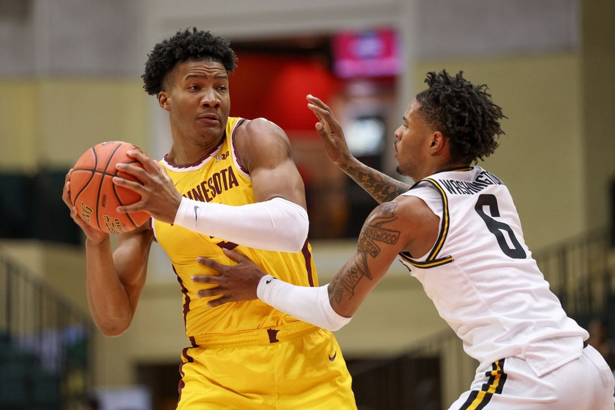 Nov 28, 2024; Orlando, Florida, USA; Minnesota Golden Gophers center Trey Edmonds (5) is guarded by Wichita State Shockers forward Corey Washington (6) in the first half at ESPN Wide World of Sports Complex. Mandatory Credit: Nathan Ray Seebeck-Imagn Images