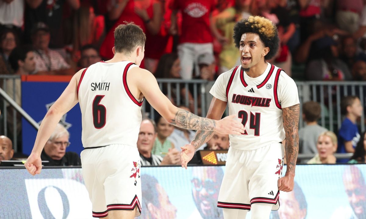 Nov 28, 2024; Paradise Island, Bahamas, BHS; Louisville Cardinals guard Chucky Hepburn (24) celebrates with Louisville Cardinals guard Reyne Smith (6) during the second half against the West Virginia Mountaineers at Imperial Arena at the Atlantis resort.  Mandatory Credit: Kevin Jairaj-Imagn Images