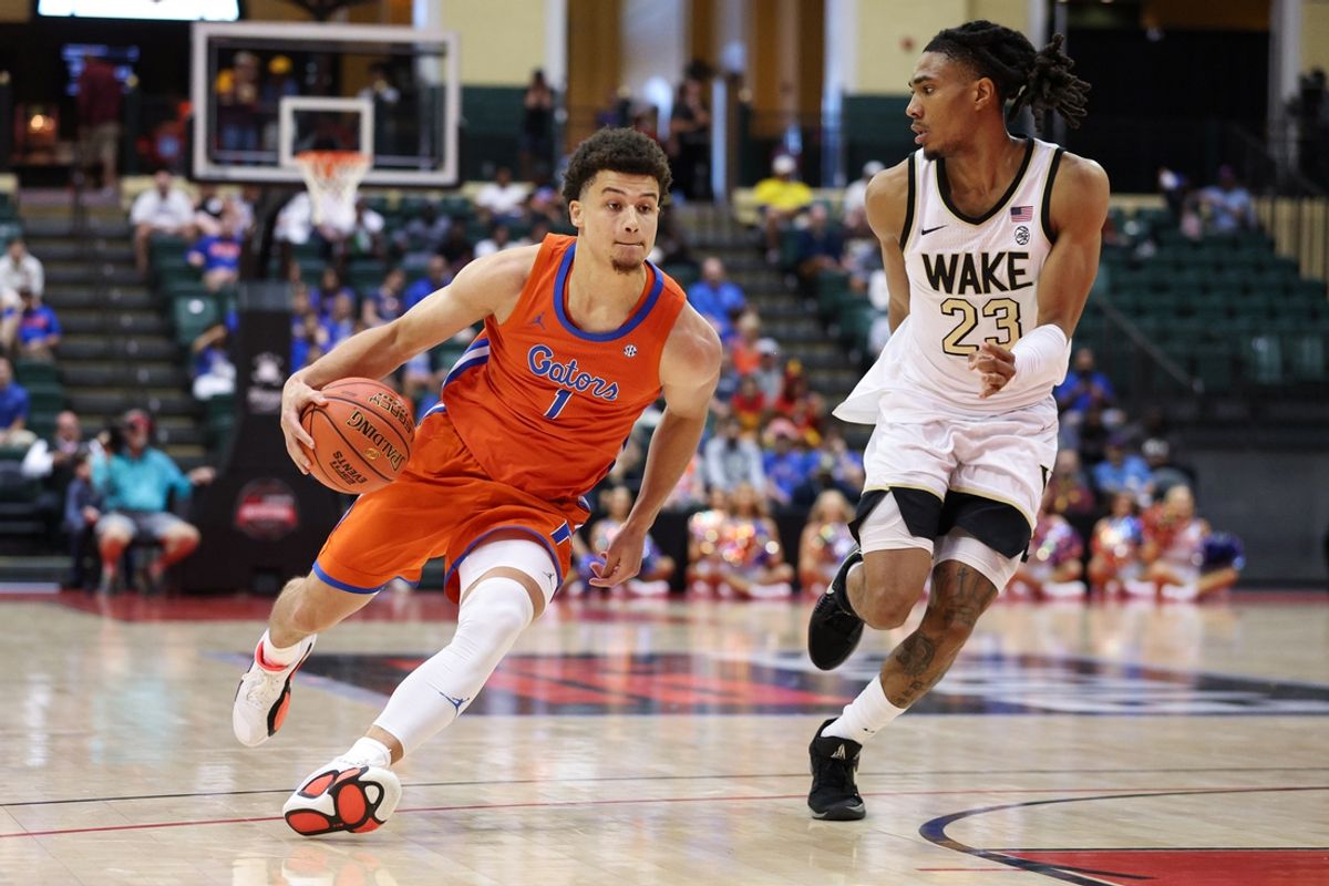 Nov 28, 2024; Orlando, Florida, USA; Florida Gators guard Walter Clayton Jr. (1) drives the ball past Wake Forest Demon Deacons guard Hunter Sallis (23) in the first half  at ESPN Wide World of Sports Complex. Mandatory Credit: Nathan Ray Seebeck-Imagn Images