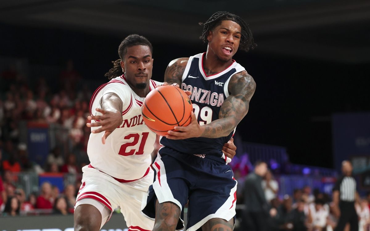 Nov 28, 2024; Paradise Island, Bahamas, BHS;  Gonzaga Bulldogs guard Khalif Battle (99) controls the ball as Indiana Hoosiers forward Mackenzie Mgbako (21) defends during the first half at Imperial Arena at the Atlantis resort. Mandatory Credit: Kevin Jairaj-Imagn Images