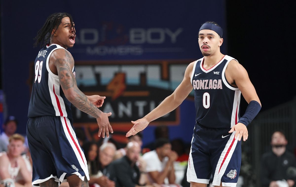 Nov 28, 2024; Paradise Island, Bahamas, BHS;  Gonzaga Bulldogs guard Khalif Battle (99) celebrates with Gonzaga Bulldogs guard Ryan Nembhard (0) during the second half against the Indiana Hoosiers at Imperial Arena at the Atlantis resort. Mandatory Credit: Kevin Jairaj-Imagn Images