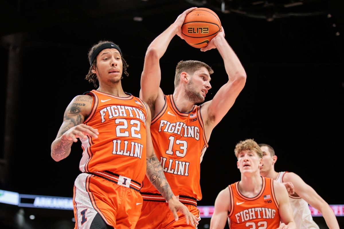 Nov 28, 2024; Kansas City, Missouri, USA; Illinois Fighting Illini center Tomislav Ivisic (13) rebound during the first half against the Arkansas Razorbacks at T-Mobile Center. Mandatory Credit: William Purnell-Imagn Images