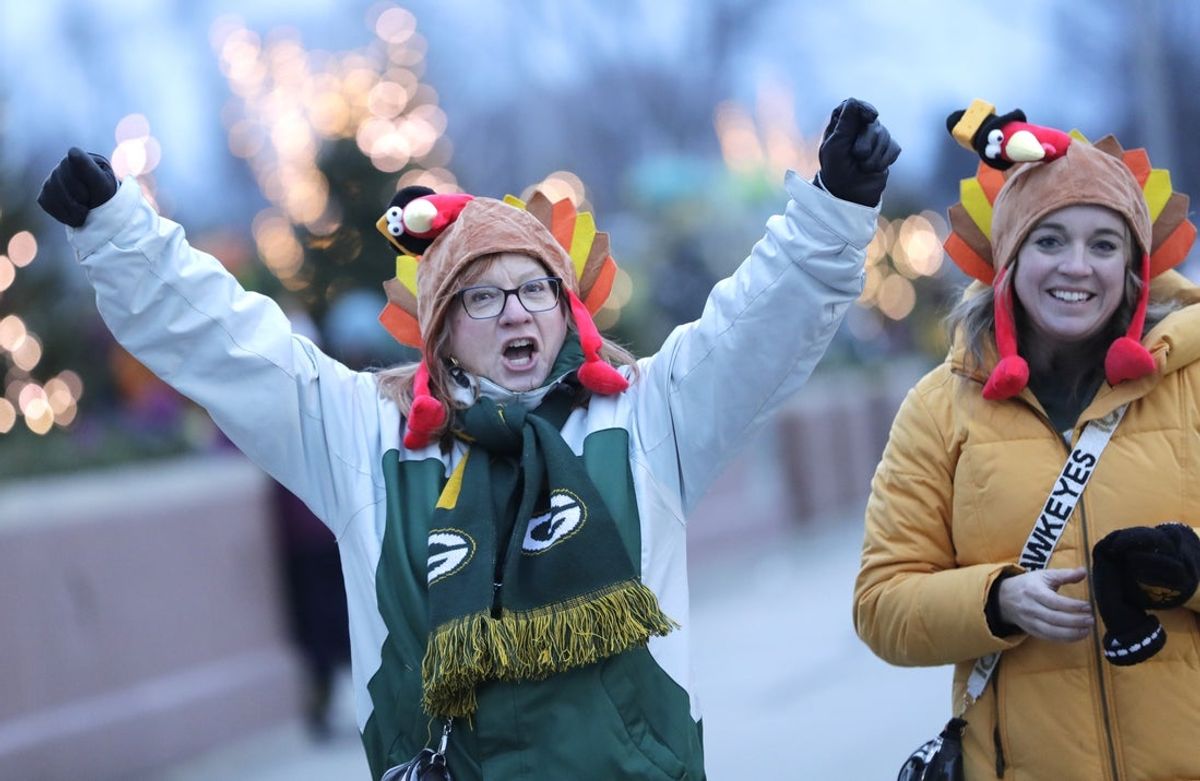 Nov 28, 2024; Green Bay, Wisconsin, USA; Shelly Jessen, left,  and Leah Adolphson are excited for the Green Bay Packers to play against the Miami Dolphins as they don turkey hats for Thanksgiving prior to the football game at Lambeau Field. Mandatory Credit: Dan Powers/USA TODAY NETWORK