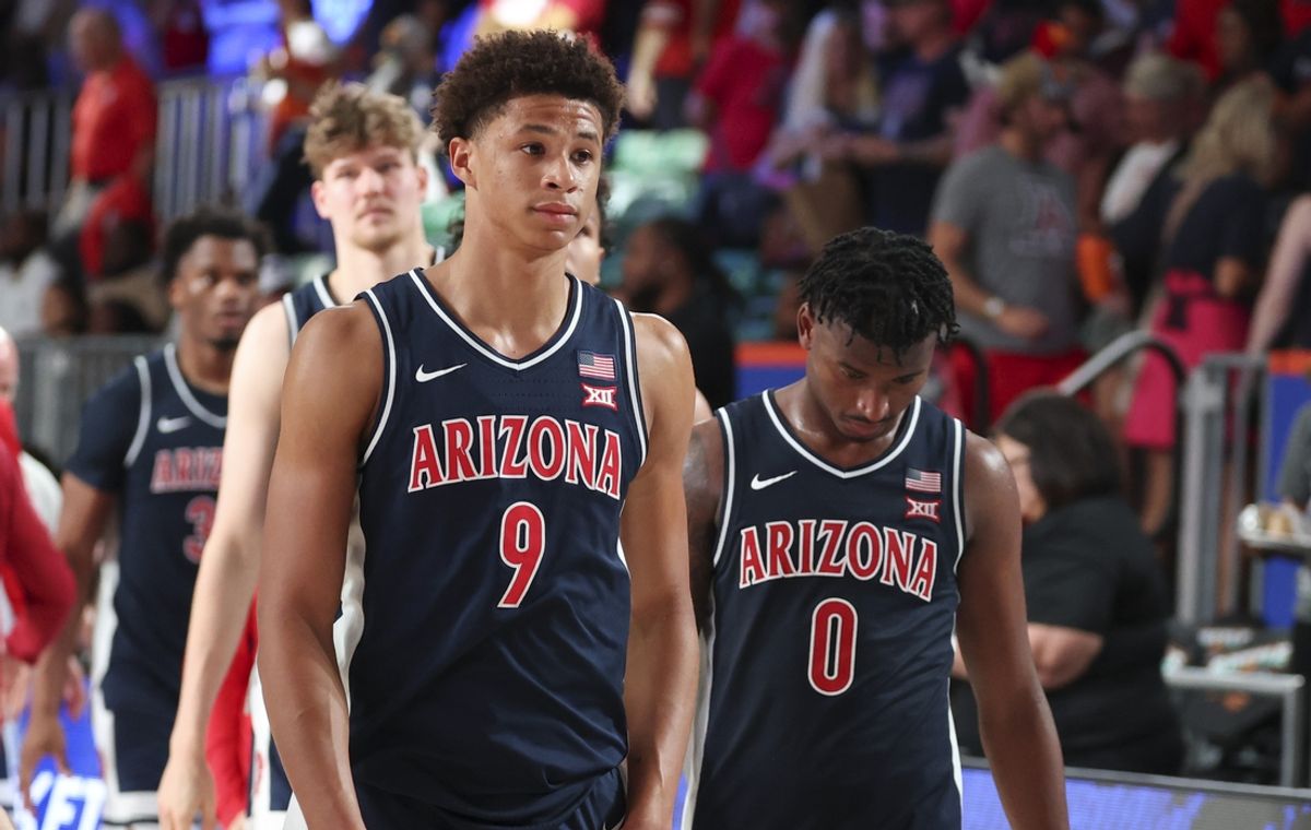Nov 28, 2024;  Paradise Island, Bahamas, BHS; Arizona Wildcats forward Carter Bryant (9) and Arizona Wildcats guard Jaden Bradley (0) react after the game against the Oklahoma Sooners in the Imperial Arena at the Atlantis Resort.  Mandatory Credit: Kevin Jairaj-Imagn Images