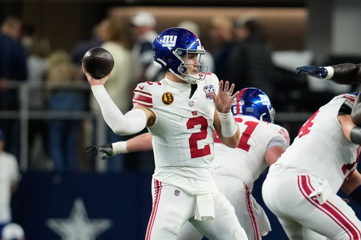 Nov 28, 2024; Arlington, Texas, USA;  New York Giants quarterback Drew Lock (2) throws a pass against the Dallas Cowboys during the first half at AT&T Stadium. Mandatory Credit: Chris Jones-Imagn Images