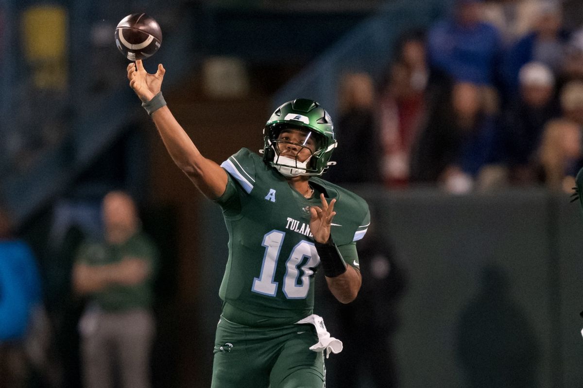 Nov 28, 2024; New Orleans, Louisiana, USA;  Tulane Green Wave quarterback Darian Mensah (10) throws against the Memphis Tigers during the first quarter at Yulman Stadium. Mandatory Credit: Matthew Hinton-Imagn Images