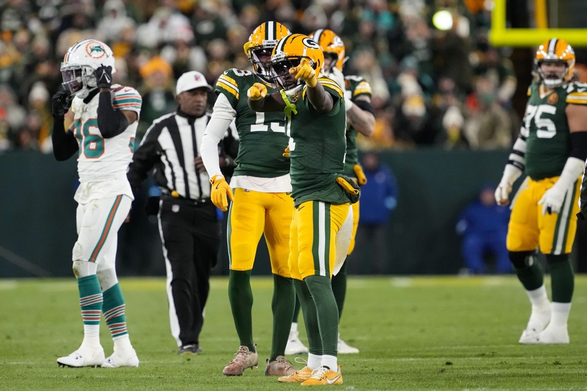 Nov 28, 2024; Green Bay, Wisconsin, USA;  Green Bay Packers wide receiver Jayden Reed (11) celebrates after earning a first down during the second quarter against the == at Lambeau Field. Mandatory Credit: Jeff Hanisch-Imagn Images