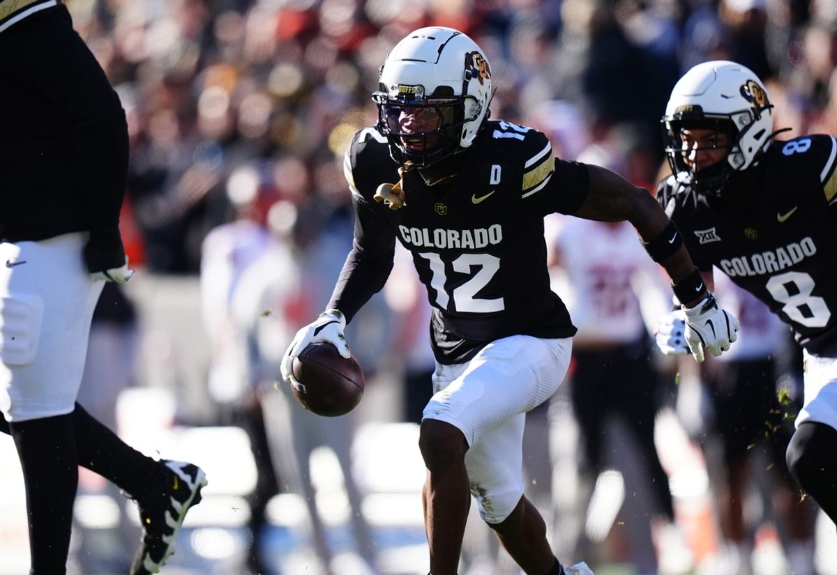 Nov 29, 2024; Boulder, Colorado, USA; Colorado Buffaloes cornerback Travis Hunter (12) following an interception in the first quarter against the Oklahoma State Cowboys  at Folsom Field. Mandatory Credit: Ron Chenoy-Imagn Images