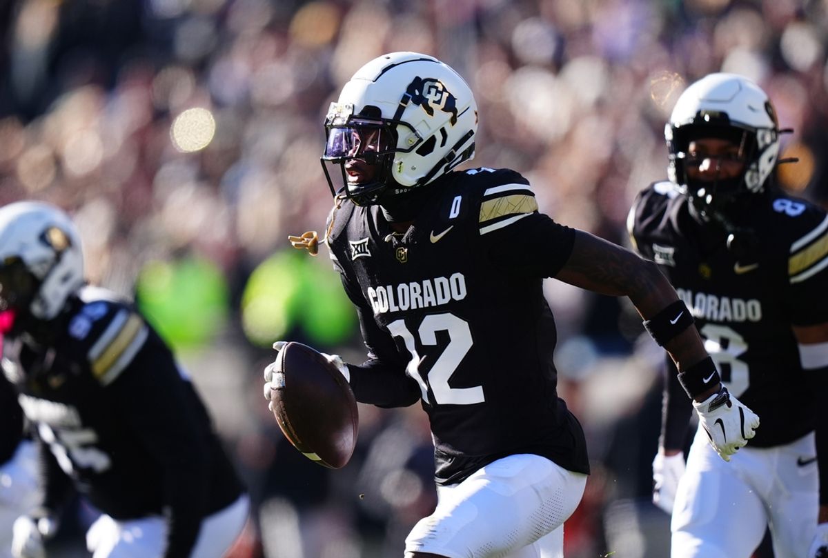 Nov 29, 2024; Boulder, Colorado, USA; Colorado Buffaloes cornerback Travis Hunter (12) following an interception in the first quarter against the Oklahoma State Cowboys  at Folsom Field. Mandatory Credit: Ron Chenoy-Imagn Images