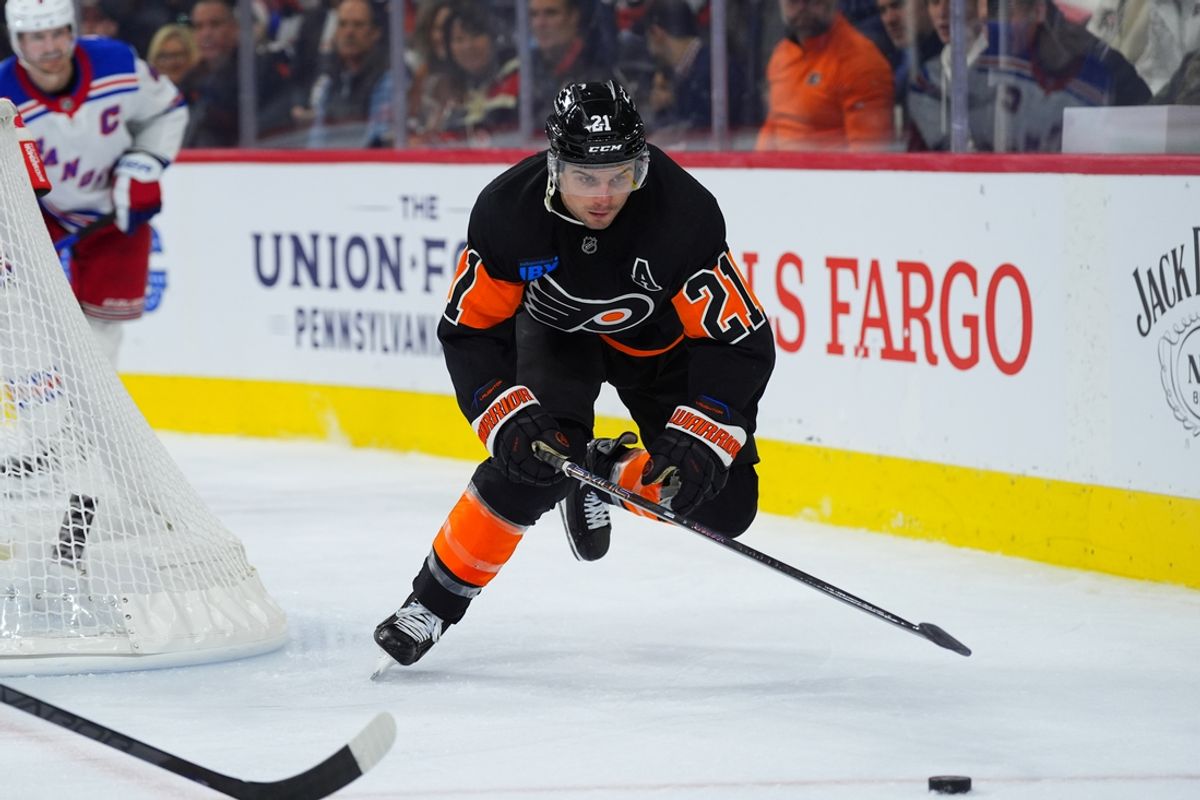 Nov 29, 2024; Philadelphia, Pennsylvania, USA; Philadelphia Flyers center Scott Laughton (21) reaches for the puck against the New York Rangers in the third period at Wells Fargo Center. Mandatory Credit: Kyle Ross-Imagn Images