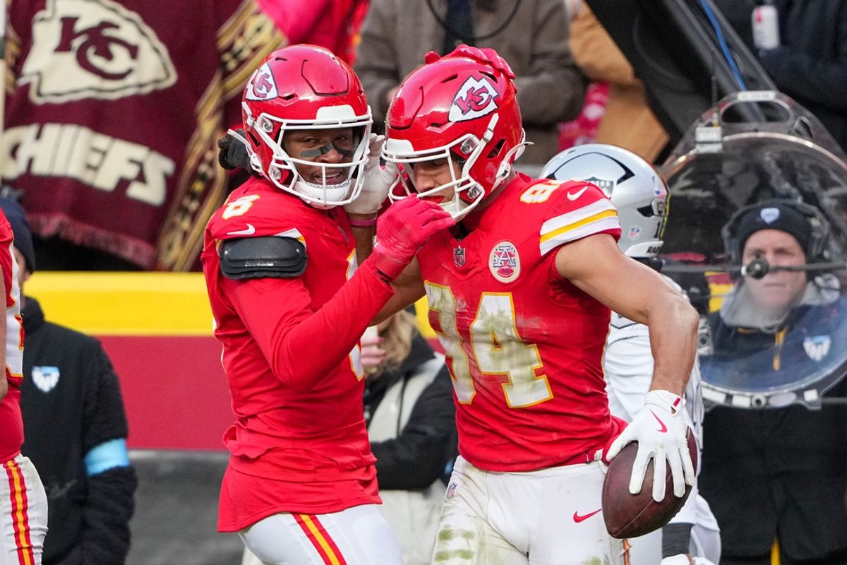 Nov 29, 2024; Kansas City, Missouri, USA; Kansas City Chiefs wide receiver Justin Watson (84) celebrates with wide receiver DeAndre Hopkins (8) after scoring against the Las Vegas Raiders during the first half at GEHA Field at Arrowhead Stadium. Mandatory Credit: Denny Medley-Imagn Images