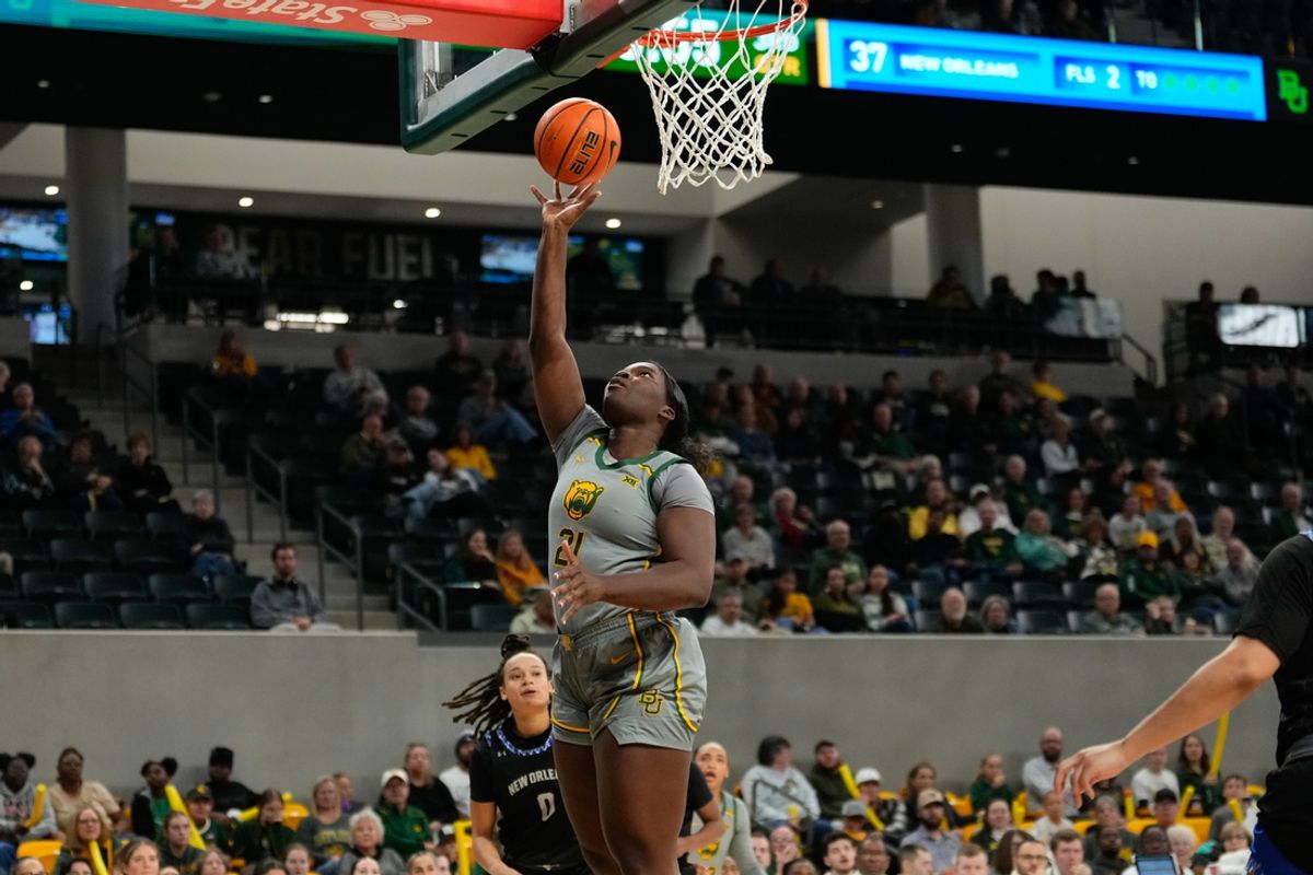Nov 29, 2024; Waco, Texas, USA;  Baylor Lady Bears center Aaronette Vonleh (21) scores a layup against New Orleans Privateers center Nora Francois (0) during the second half at Ferrell Center. Mandatory Credit: Chris Jones-Imagn Images