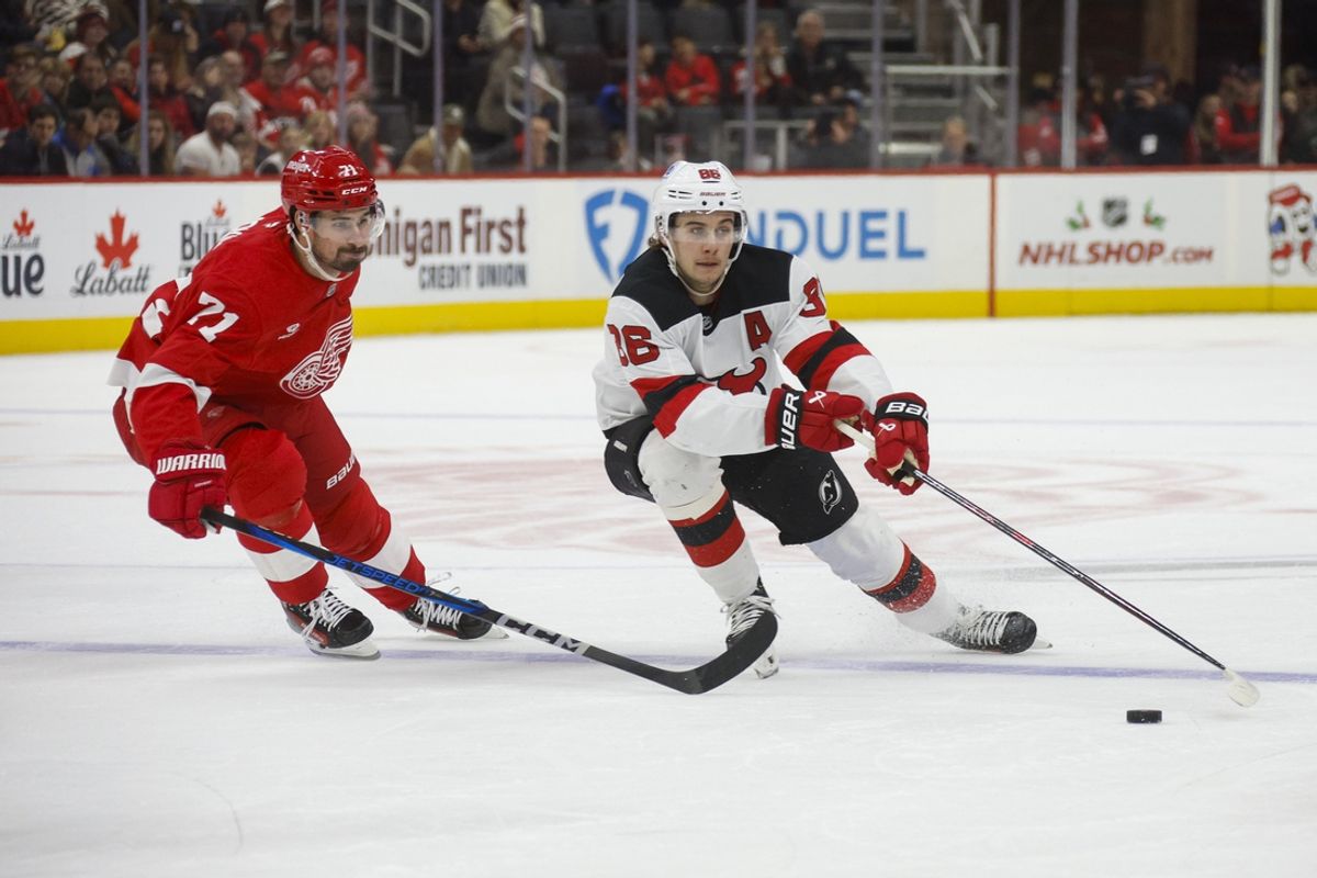 Nov 29, 2024; Detroit, Michigan, USA; New Jersey Devils center Jack Hughes (86) handles the puck during the first period against the Detroit Red Wings at Little Caesars Arena. Mandatory Credit: Brian Bradshaw Sevald-Imagn Images