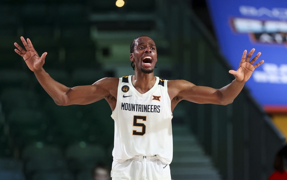 Nov 29, 2024; Paradise Island, Bahamas, BHS;  West Virginia Mountaineers guard Toby Okani (5) reacts against the Arizona Wildcats during overtime at Imperial Arena at the Atlantis resort.  Mandatory Credit: Kevin Jairaj-Imagn Images
