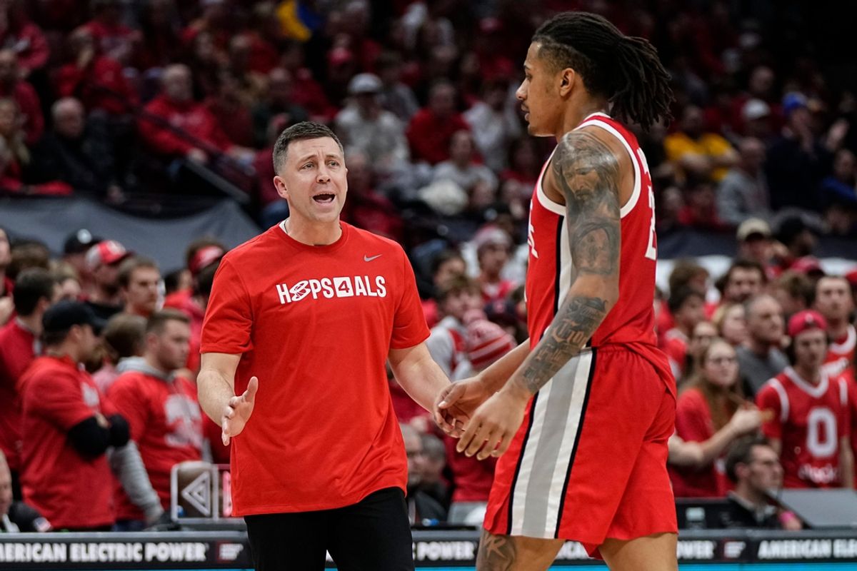 Ohio State Buckeyes head coach Jake Diebler talks to Ohio State Buckeyes forward Devin Royal (21) during the second half of the NCAA men's basketball game against the Pittsburgh Panthers at Value City Arena in Columbus on Friday, Nov. 29, 2024. Ohio State lost 91-90 on a last second shot in overtime.