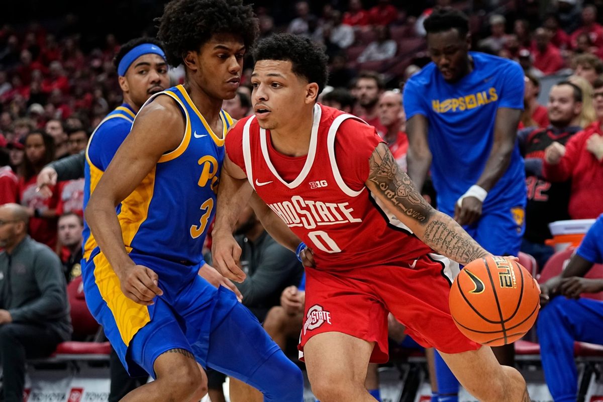 Ohio State Buckeyes guard John Mobley Jr. (0) dribbles around Pittsburgh Panthers guard Brandin Cummings (3) during the first half of the NCAA men's basketball game at Value City Arena in Columbus on Friday, Nov. 29, 2024.