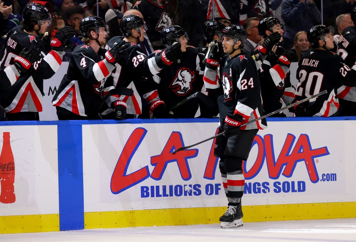 Nov 29, 2024; Buffalo, New York, USA;  Buffalo Sabres center Dylan Cozens (24) celebrates his goal with teammates during the third period against the Vancouver Canucks at KeyBank Center. Mandatory Credit: Timothy T. Ludwig-Imagn Images