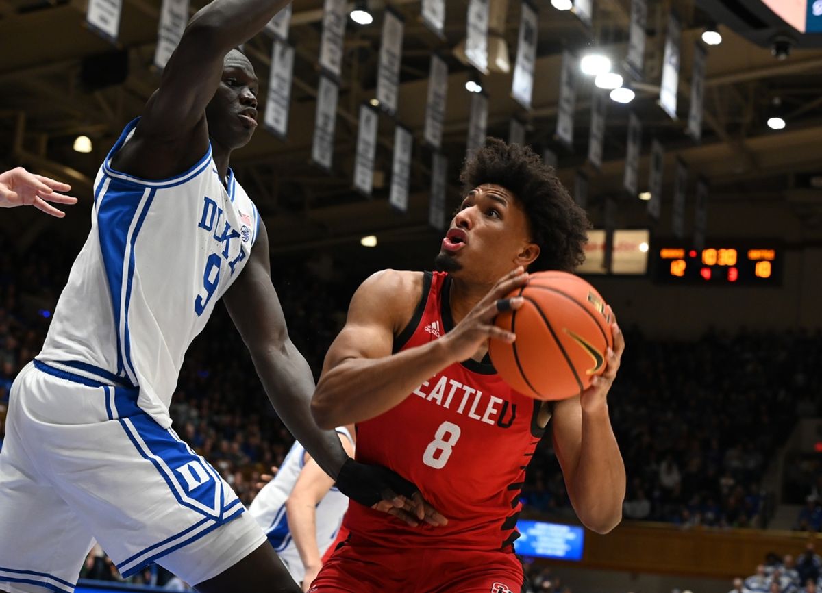 Nov 29, 2024; Durham, North Carolina, USA;  Seattle Redhawks forward Malek Gomma (8) looks to shoot over Duke Blue Devils center Khaman Maluach (9) during the first half at Cameron Indoor Stadium. Mandatory Credit: Rob Kinnan-Imagn Images