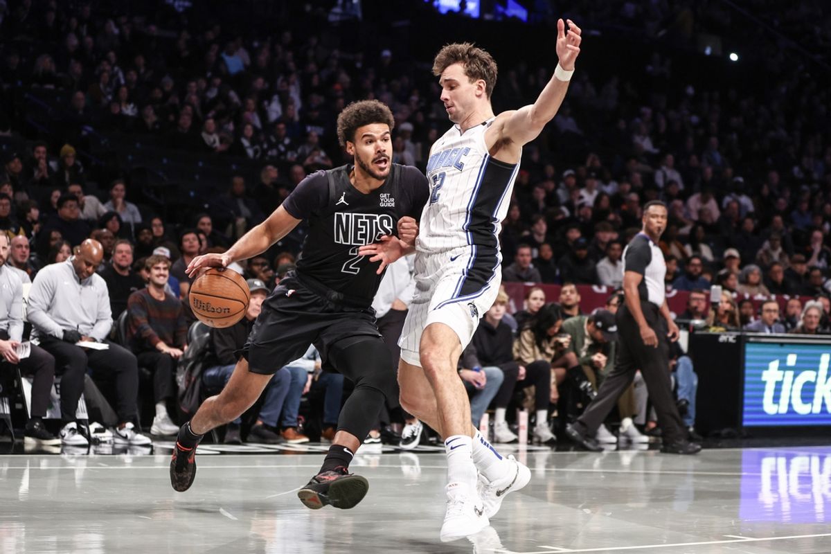 Nov 29, 2024; Brooklyn, New York, USA;  Brooklyn Nets forward Cameron Johnson (2) looks to drive past Orlando Magic forward Franz Wagner (22) in the first quarter at Barclays Center. Mandatory Credit: Wendell Cruz-Imagn Images