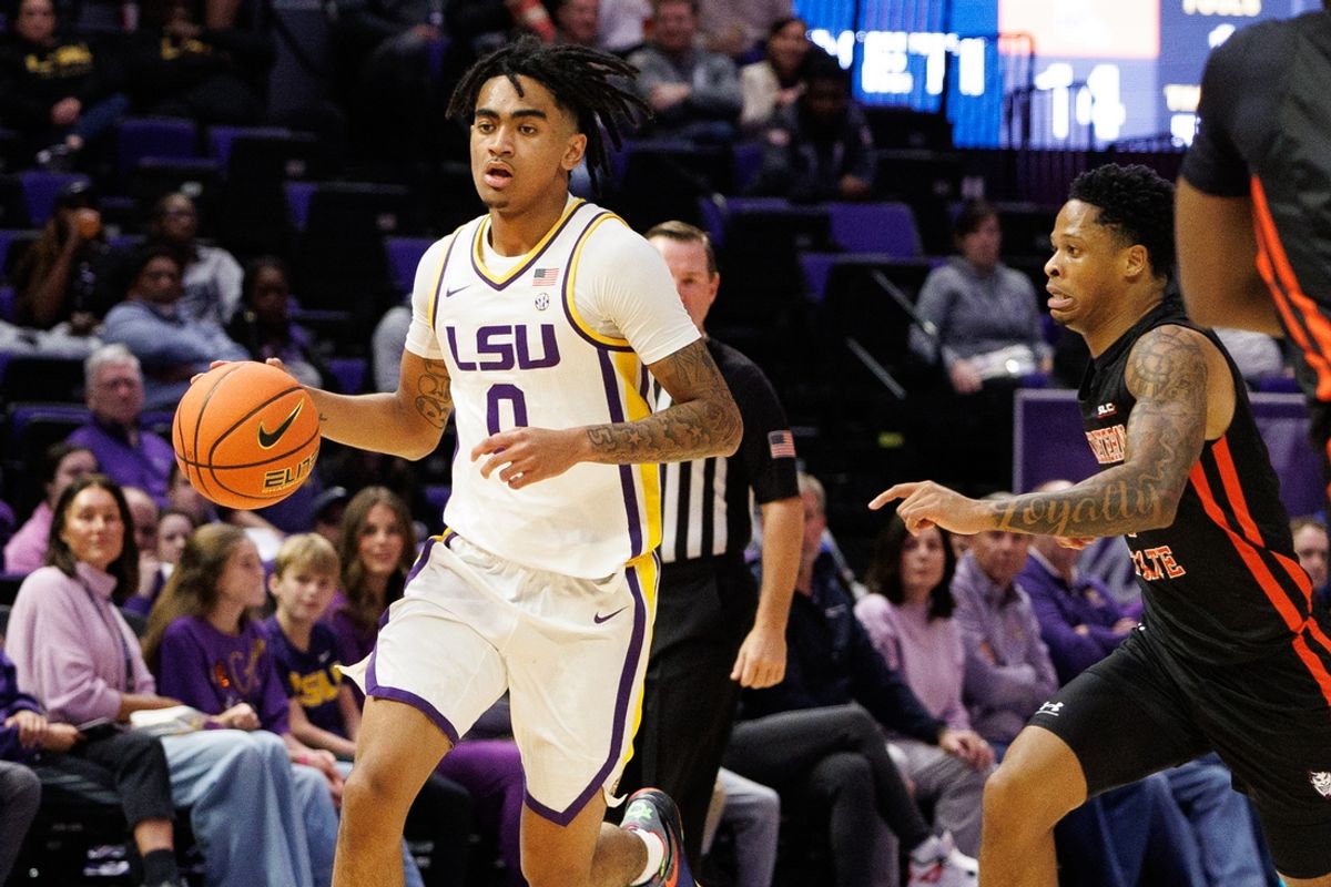 Nov 29, 2024; Baton Rouge, Louisiana, USA;  LSU Tigers guard Vyctorius Miller (0) dribbles against the Northwestern State Demons during the first half at Pete Maravich Assembly Center. Mandatory Credit: Stephen Lew-Imagn Images