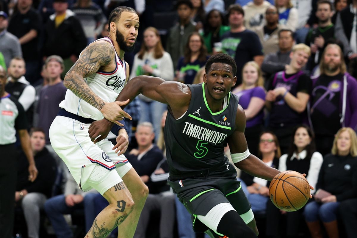 Nov 29, 2024; Minneapolis, Minnesota, USA; Minnesota Timberwolves guard Anthony Edwards (5) works around LA Clippers guard Amir Coffey (7) during the second half of an NBA Cup game at Target Center. Mandatory Credit: Matt Krohn-Imagn Images