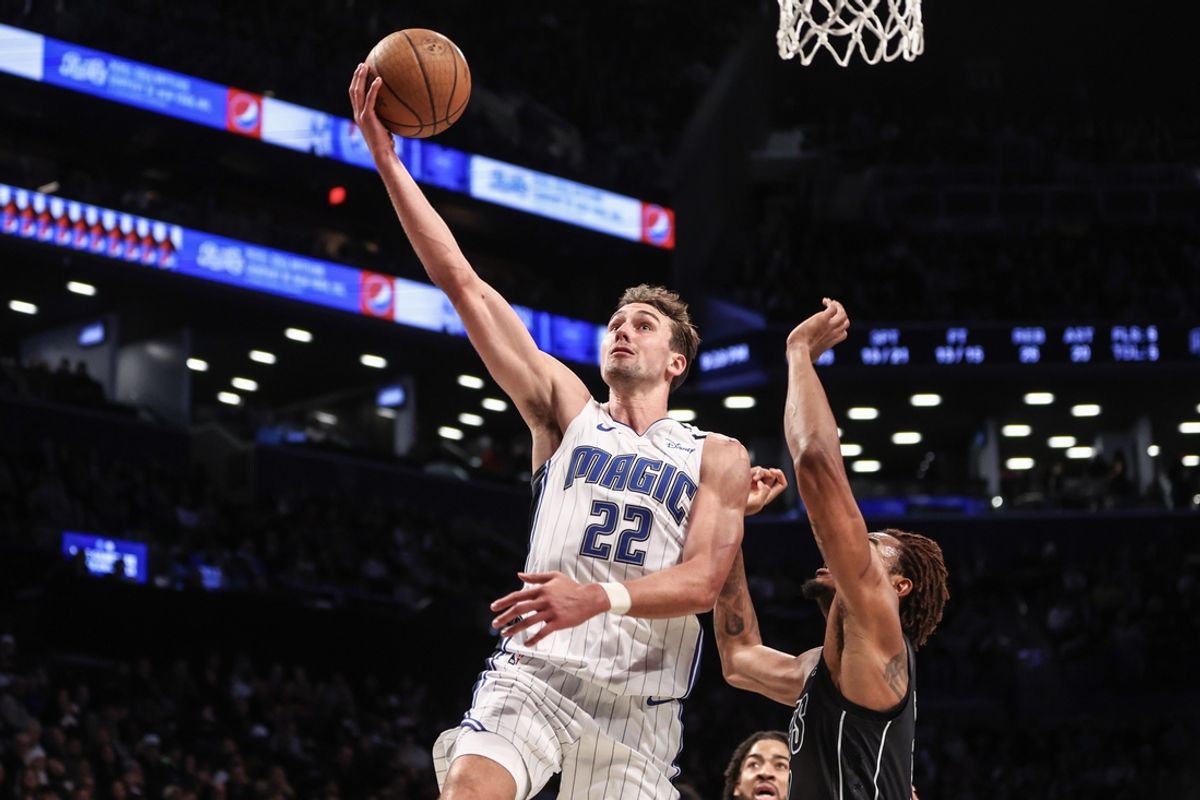 Nov 29, 2024; Brooklyn, New York, USA;  Orlando Magic forward Franz Wagner (22) drives to the basket for a layup in the third quarter against the Brooklyn Nets at Barclays Center. Mandatory Credit: Wendell Cruz-Imagn Images