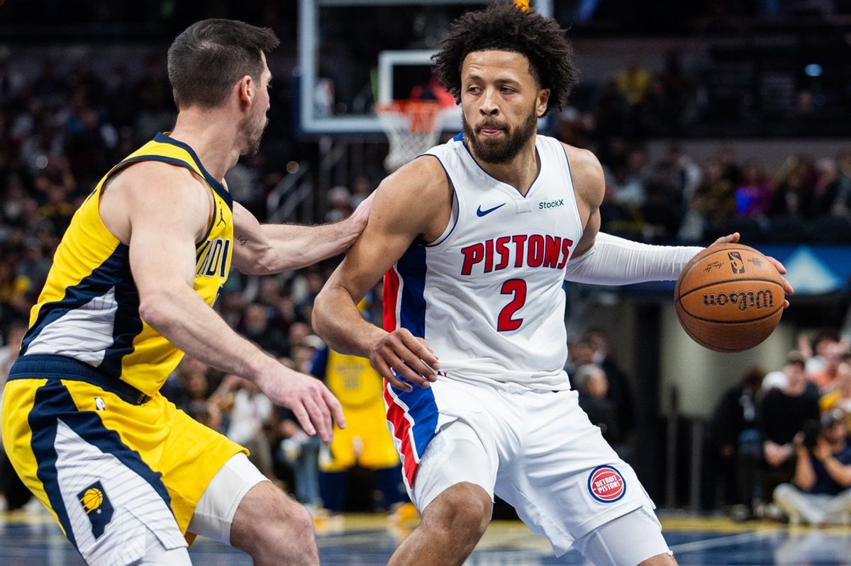 Nov 29, 2024; Indianapolis, Indiana, USA; Detroit Pistons guard Cade Cunningham (2) dribbles the ball while  Indiana Pacers guard T.J. McConnell (9) defends in the second half  at Gainbridge Fieldhouse. Mandatory Credit: Trevor Ruszkowski-Imagn Images