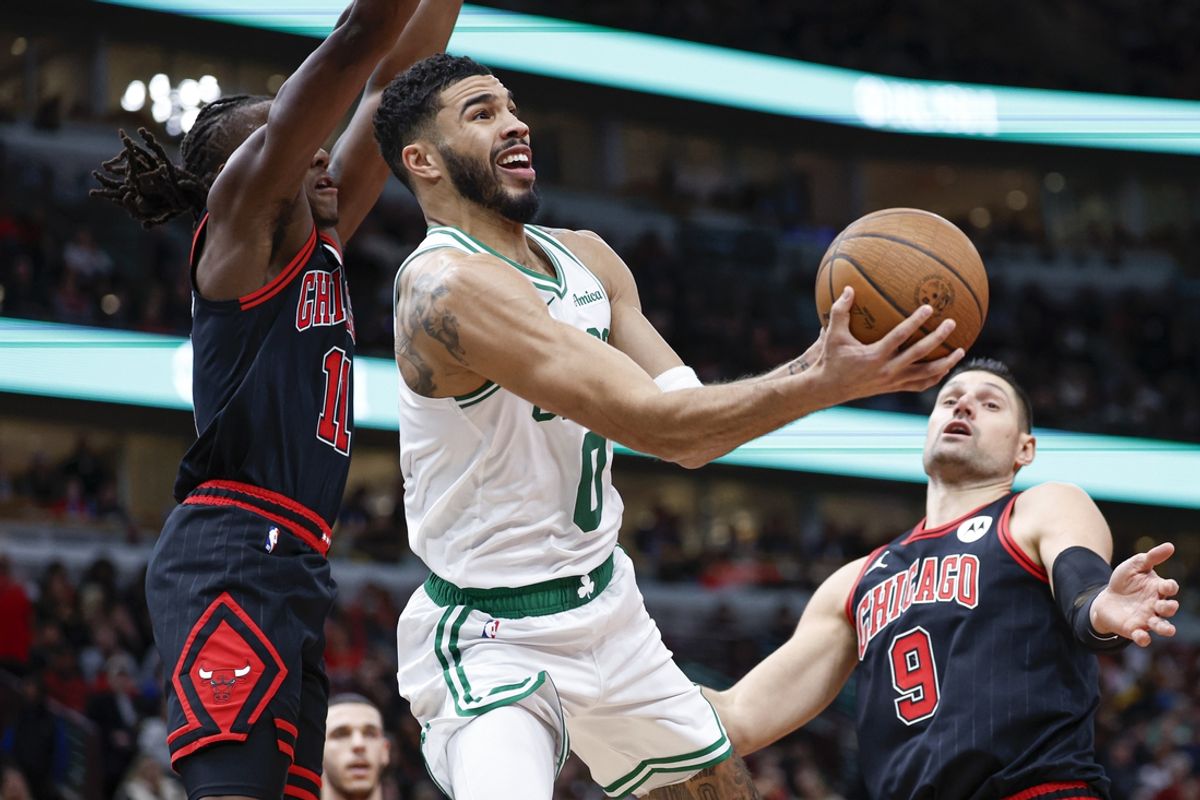 Nov 29, 2024; Chicago, Illinois, USA; Boston Celtics forward Jayson Tatum (0) drives to the basket against the Chicago Bulls during the second half at United Center. Mandatory Credit: Kamil Krzaczynski-Imagn Images