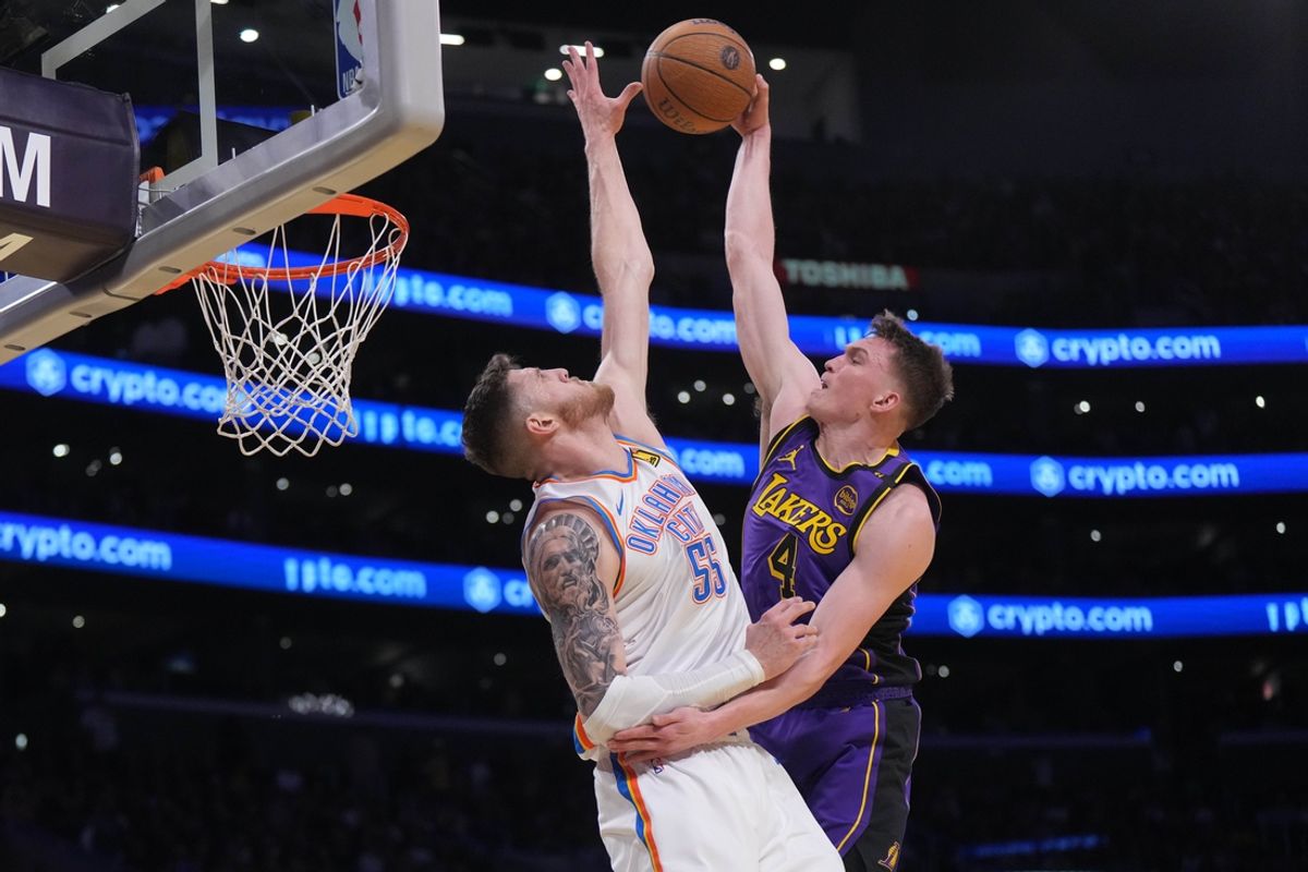 Nov 29, 2024; Los Angeles, California, USA; Los Angeles Lakers guard Dalton Knecht (4) shoots against Oklahoma City Thunder center Isaiah Hartenstein (55) in the first half  at Crypto.com Arena. Mandatory Credit: Kirby Lee-Imagn Images