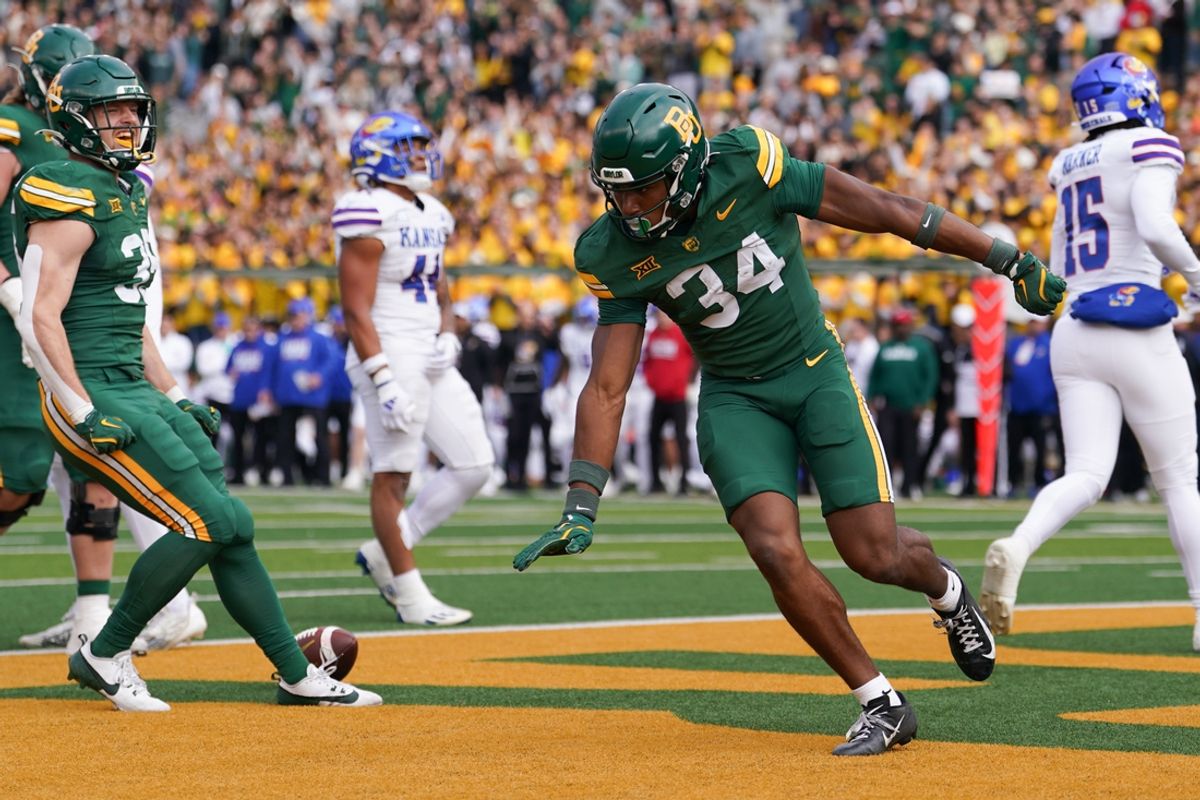 Nov 30, 2024; Waco, Texas, USA;  Baylor Bears wide receiver Josh Cameron (34) celebrates after scoring a touchdown against the Kansas Jayhawks during the first half at McLane Stadium. Mandatory Credit: Chris Jones-Imagn Images
