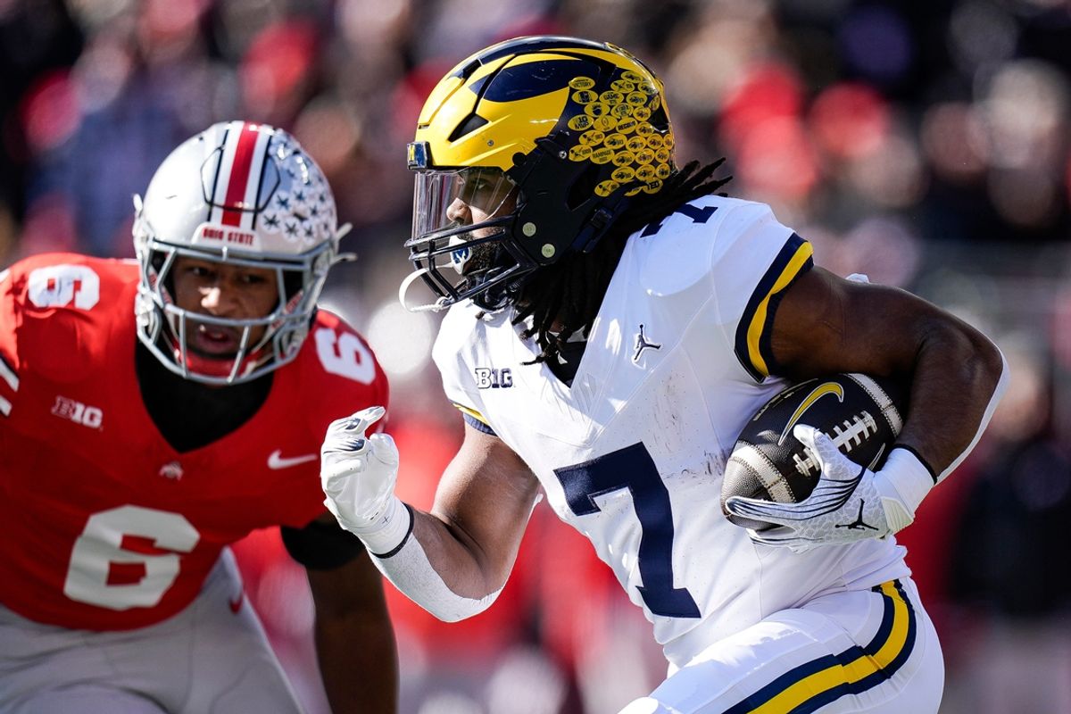Michigan running back Donovan Edwards (7) runs against Ohio State during the first half at Ohio Stadium in Columbus, Ohio on Saturday, Nov. 30, 2024.