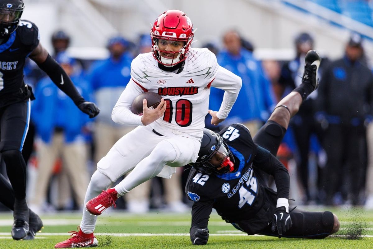 Nov 30, 2024; Lexington, Kentucky, USA; Louisville Cardinals quarterback Pierce Clarkson (10) runs the ball during the fourth quarter against the Kentucky Wildcats at Kroger Field. Mandatory Credit: Jordan Prather-Imagn Images