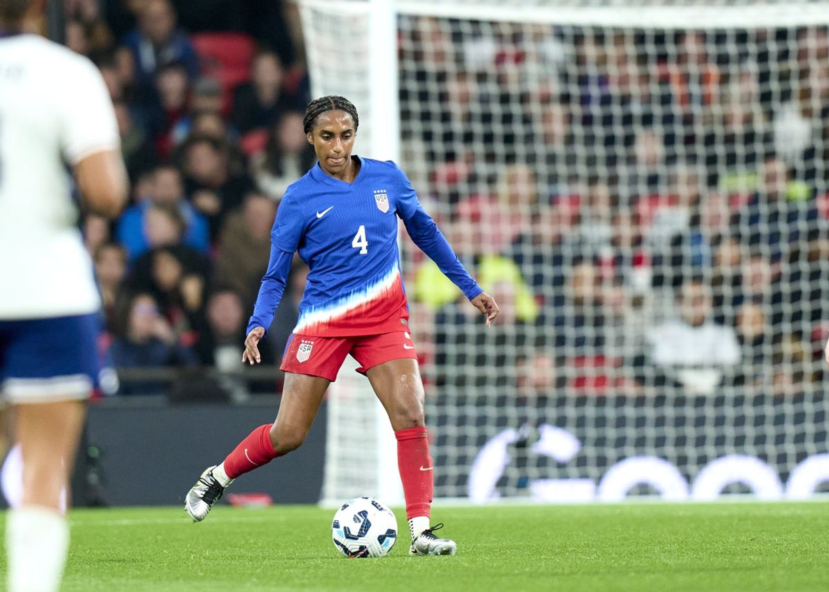 Nov 30, 2024; London, England;  United States defender Naomi Girma (4) dribbles the ball in the first half of an International friendly at Wembley Stadium. Mandatory Credit: Peter van den Berg-Imagn Images