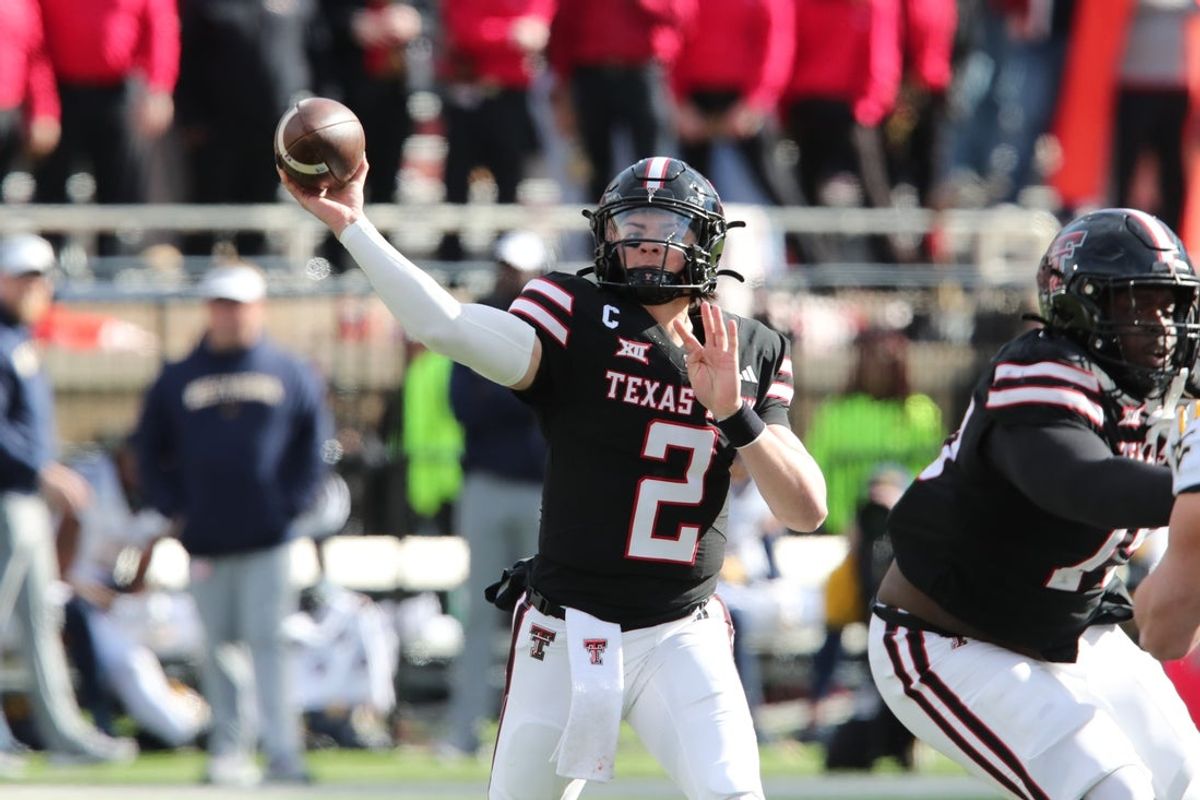 Nov 30, 2024; Lubbock, Texas, USA;  Texas Tech Red Raiders quarterback Behren Morton (2) throws  against the West Virginia Mountaineers in the second half at Jones AT&T Stadium and Cody Campbell Field. Mandatory Credit: Michael C. Johnson-Imagn Images