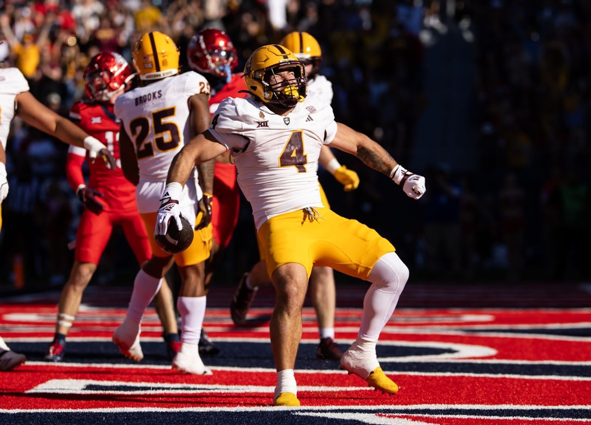 Nov 30, 2024; Tucson, Arizona, USA; Arizona State Sun Devils running back Cam Skattebo (4) celebrates after scoring a touchdown against the Arizona Wildcats in the first half during the Territorial Cup at Arizona Stadium. Mandatory Credit: Mark J. Rebilas-Imagn Images