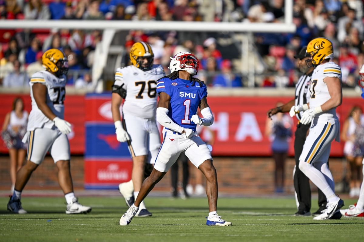 Nov 30, 2024; Dallas, Texas, USA; Southern Methodist Mustangs safety Brandon Crossley (1) celebrates a defensive stop against the California Golden Bears during the first half at Gerald J. Ford Stadium. Mandatory Credit: Jerome Miron-Imagn Images