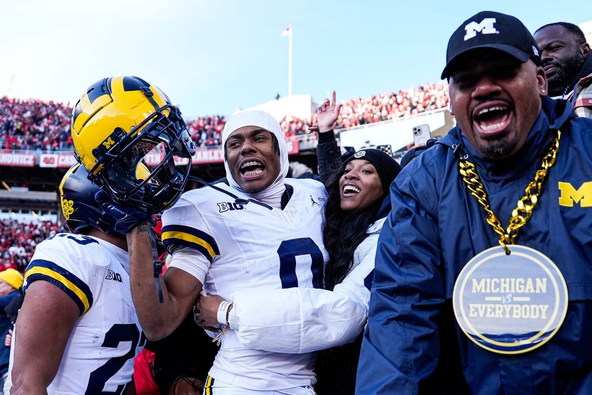 Michigan wide receiver Semaj Morgan (0) celebrate 13-10 win over Ohio State with fans at Ohio Stadium in Columbus, Ohio on Saturday, Nov. 30, 2024.